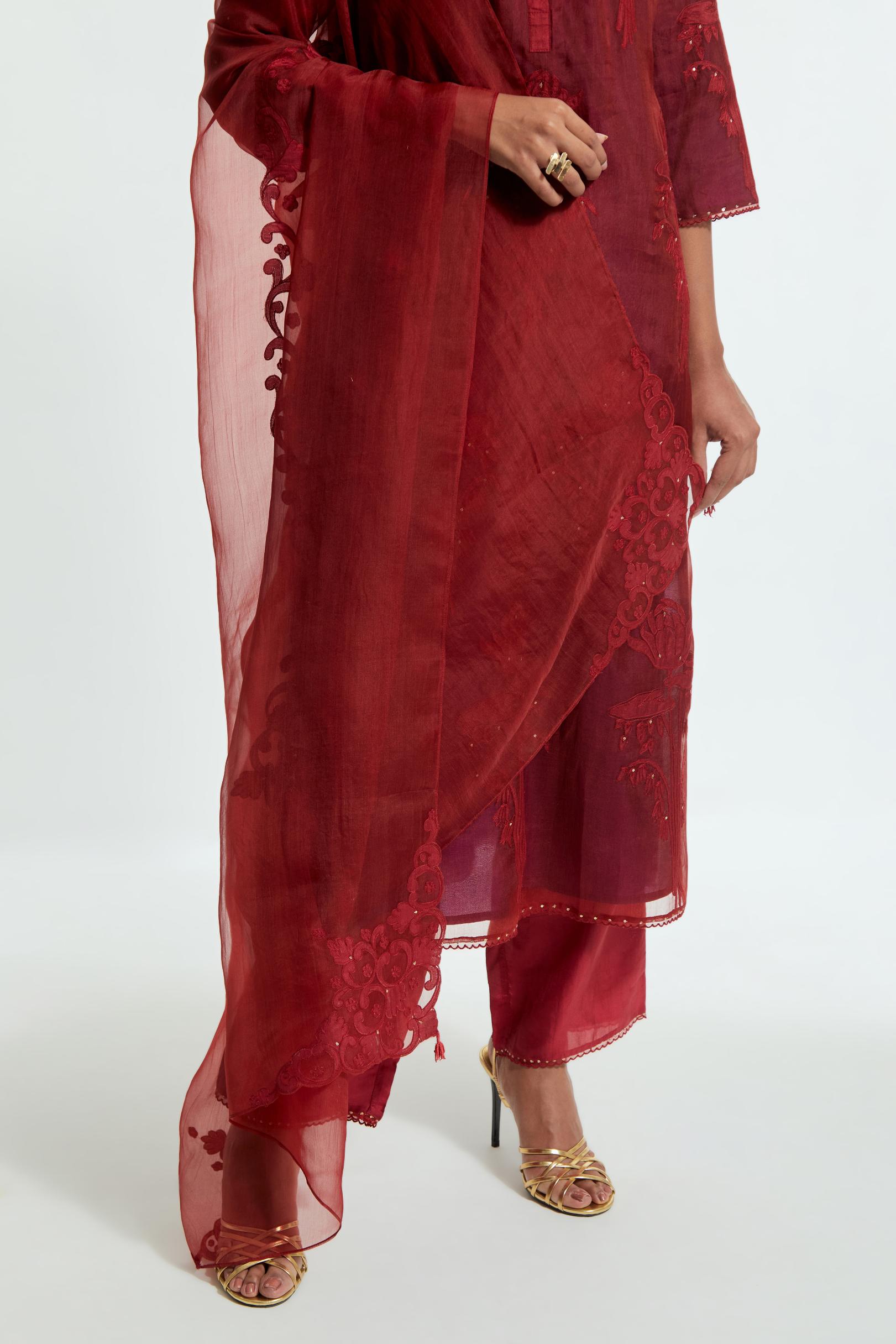 Red silk organza dupatta featuring silk appliqué embroidery, delicately highlighted with subtle sequins.