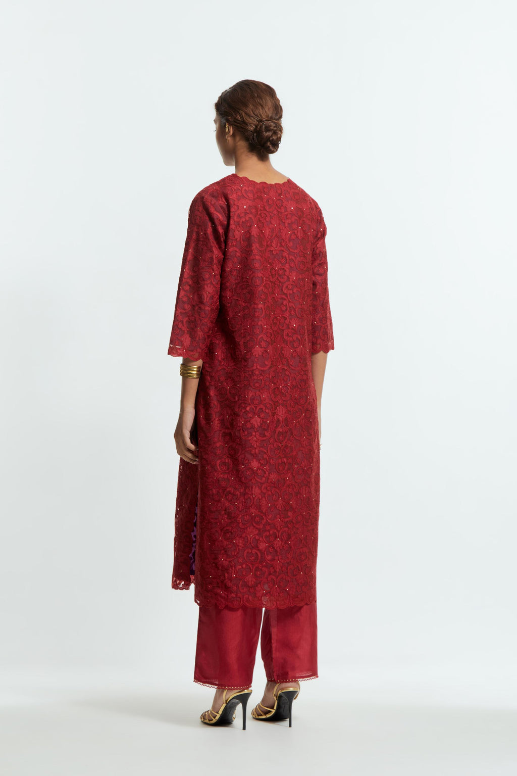 Red silk organza straight kurta set featuring an all-over silk appliqué trellis jaal, delicately highlighted with subtle sequins.
