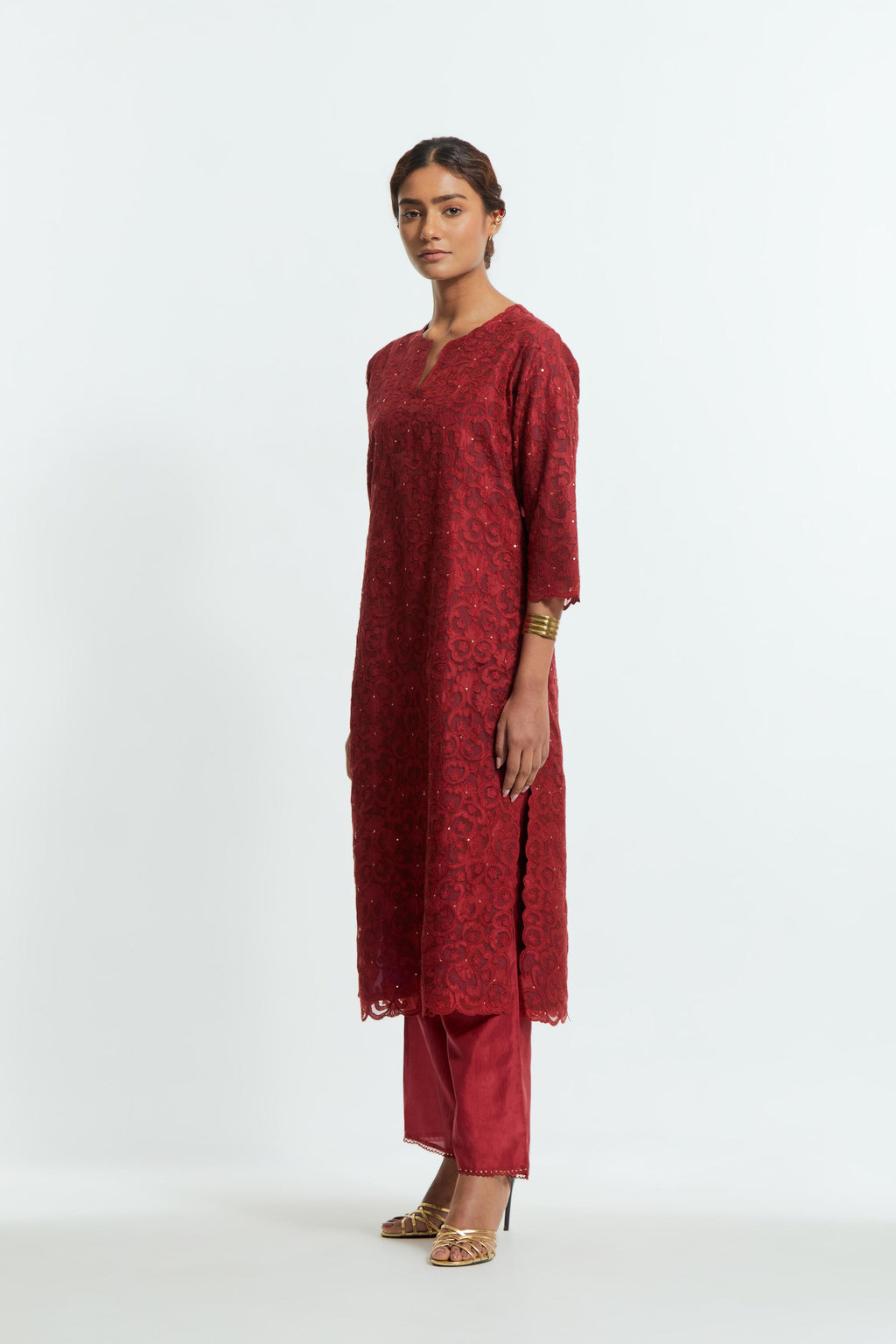 Red silk organza straight kurta set featuring an all-over silk appliqué trellis jaal, delicately highlighted with subtle sequins.
