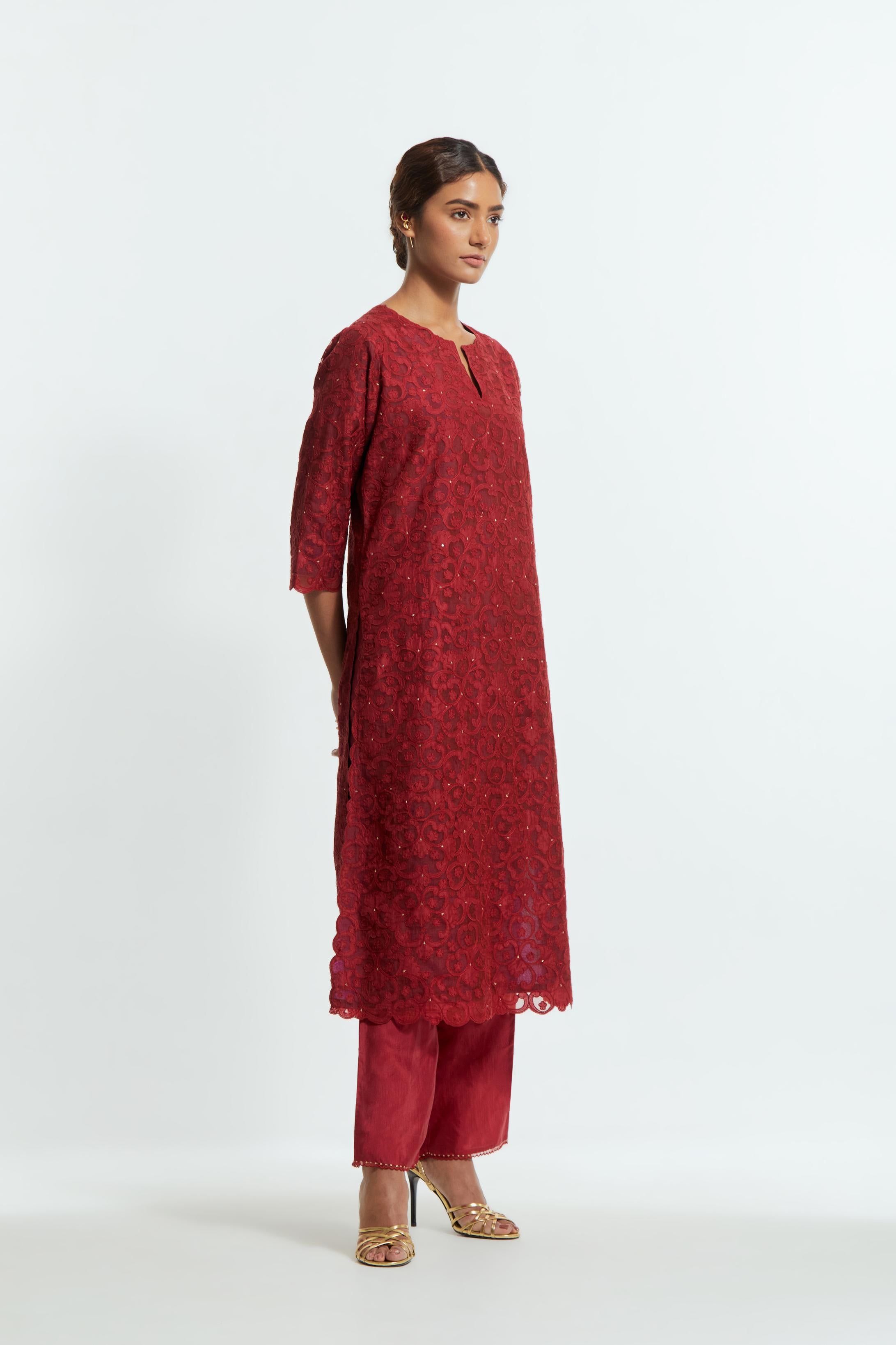 Red silk organza straight kurta set featuring an all-over silk appliqué trellis jaal, delicately highlighted with subtle sequins.
