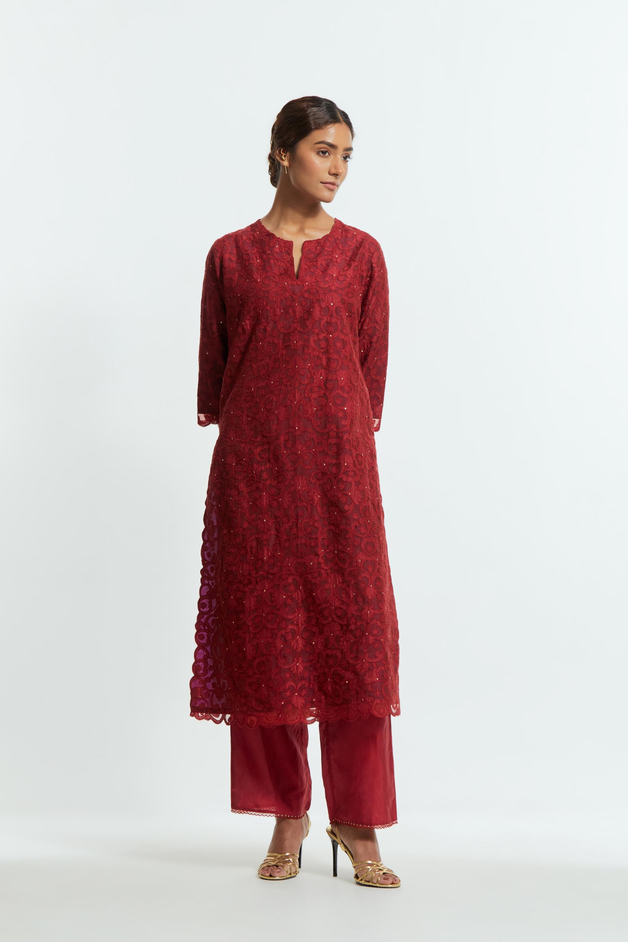 Red silk organza straight kurta set featuring an all-over silk appliqué trellis jaal, delicately highlighted with subtle sequins.