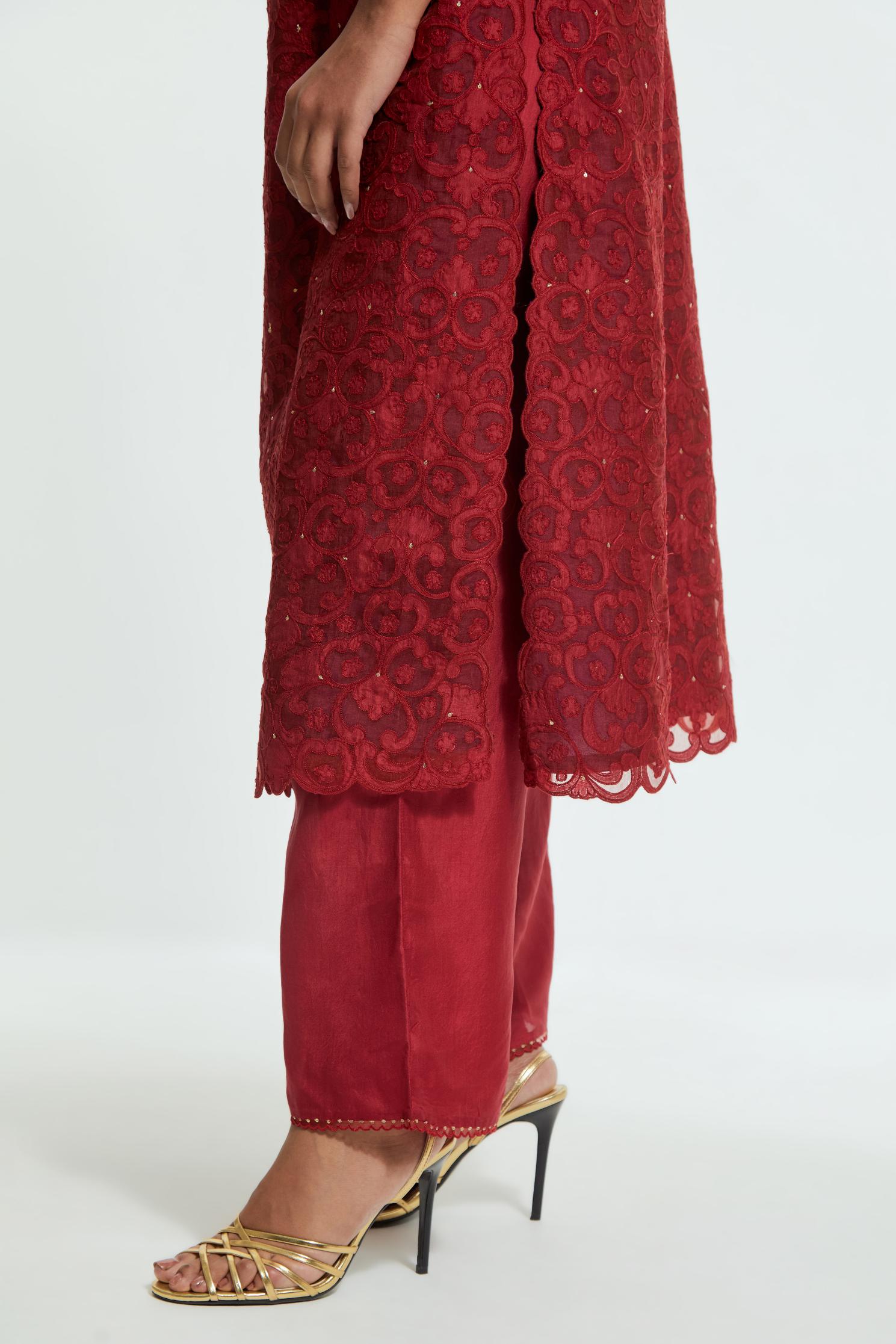 Red silk organza straight kurta set featuring an all-over silk appliqué trellis jaal, delicately highlighted with subtle sequins.