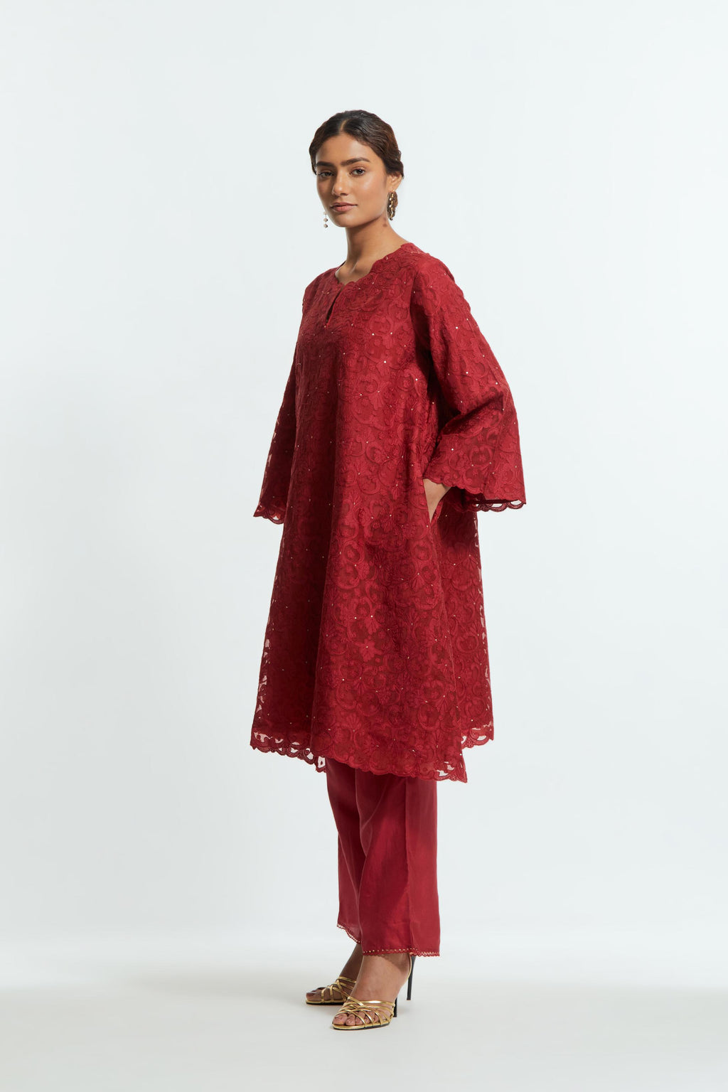 Red silk organza easy-fit short kurta set with a straight hem, featuring an all-over trellis jaal appliqué, delicately highlighted with subtle sequins.