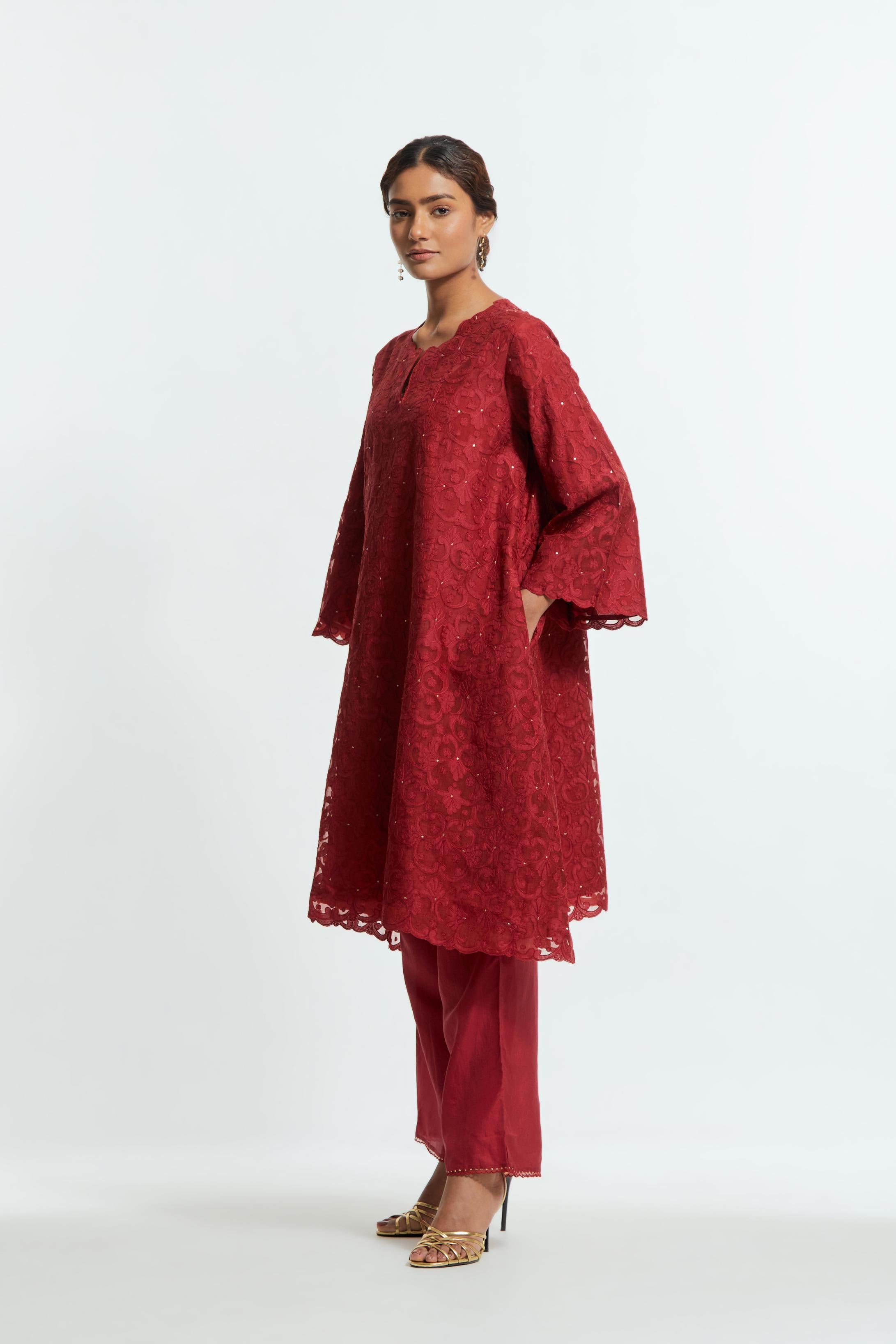 Red silk organza easy-fit short kurta set with a straight hem, featuring an all-over trellis jaal appliqué, delicately highlighted with subtle sequins.