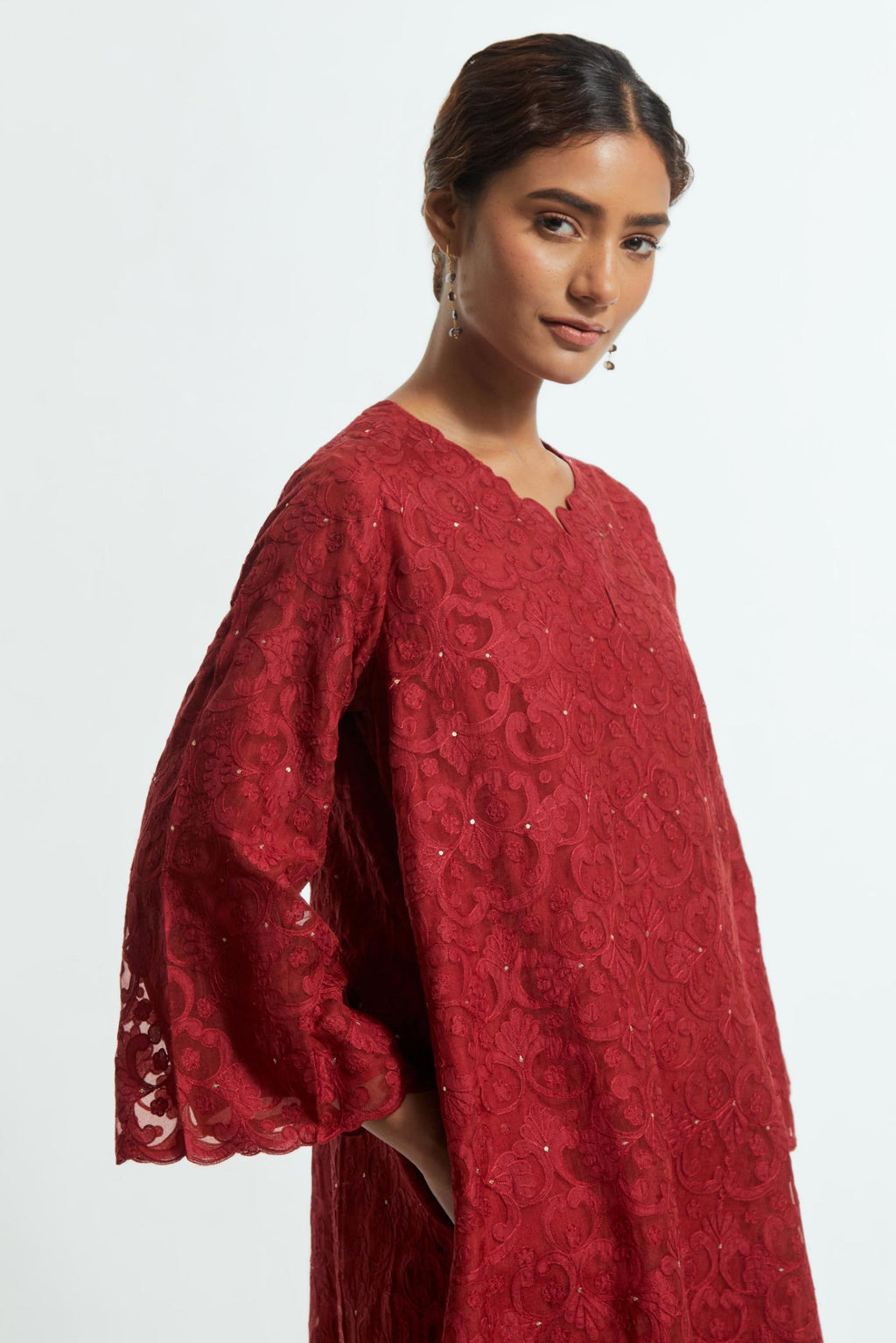 Red silk organza easy-fit short kurta set with a straight hem, featuring an all-over trellis jaal appliqué, delicately highlighted with subtle sequins.