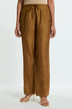 Olive silk straight pants detailed with scalloped organza edging at the hem, delicately highlighted with gold sequins work.