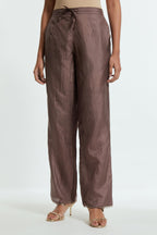 Grey silk straight pants detailed with scalloped organza edging at the hem, delicately highlighted with gold sequins work.
