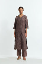 Grey silk organza straight kurta set featuring an all-over silk appliqué trellis jaal, delicately highlighted with subtle sequins.
