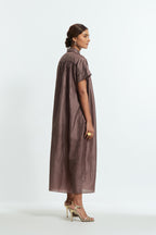 Grey silk long dress adorned with appliqué chrysanthemum floral motifs along one side, delicately highlighted with fine French knots and subtle sequins.