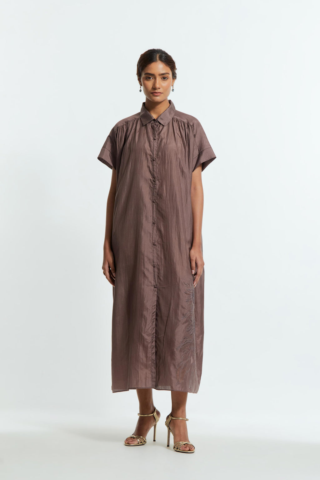 Grey silk long dress adorned with appliqué chrysanthemum floral motifs along one side, delicately highlighted with fine French knots and subtle sequins.