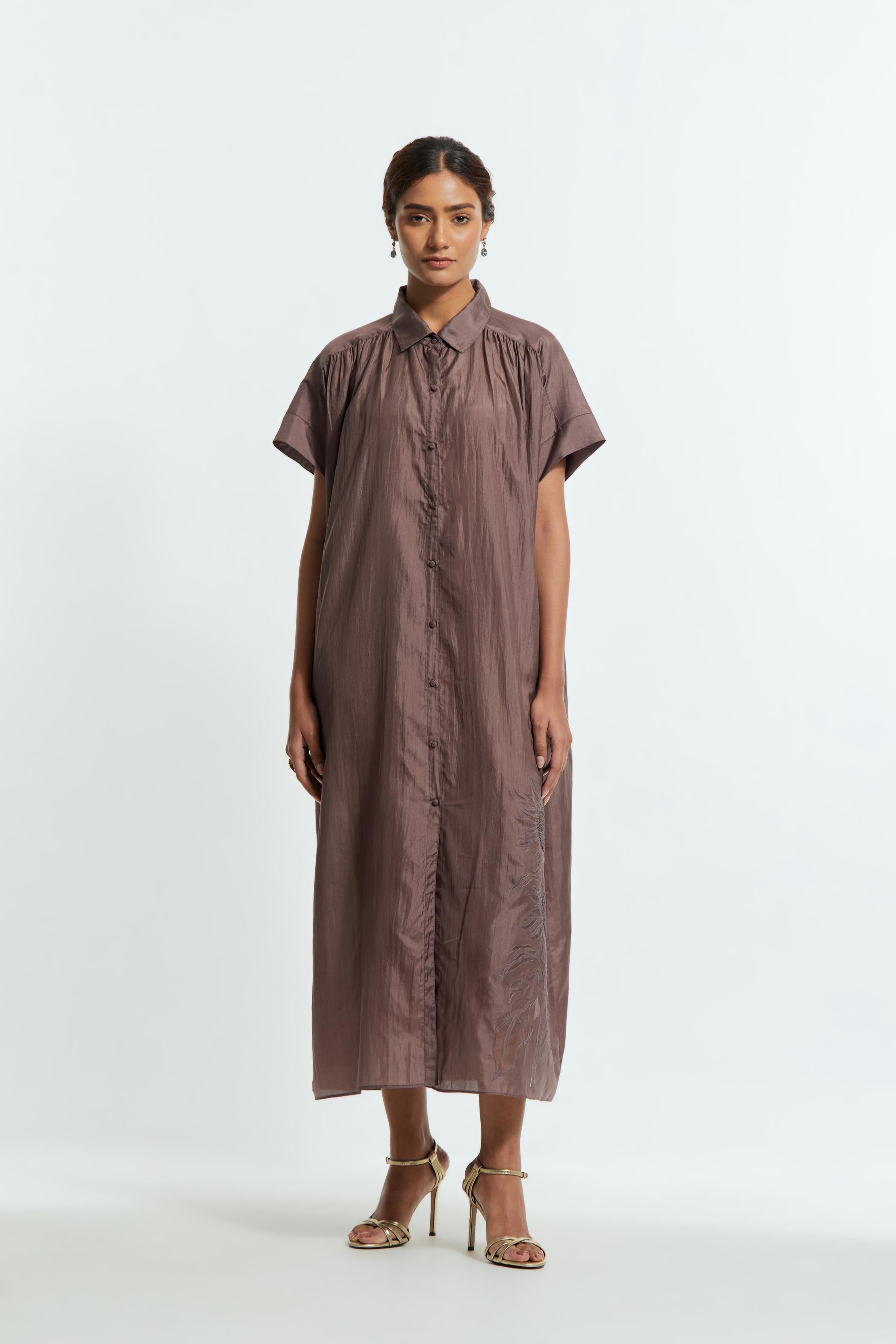 Grey silk long dress adorned with appliqué chrysanthemum floral motifs along one side, delicately highlighted with fine French knots and subtle sequins.