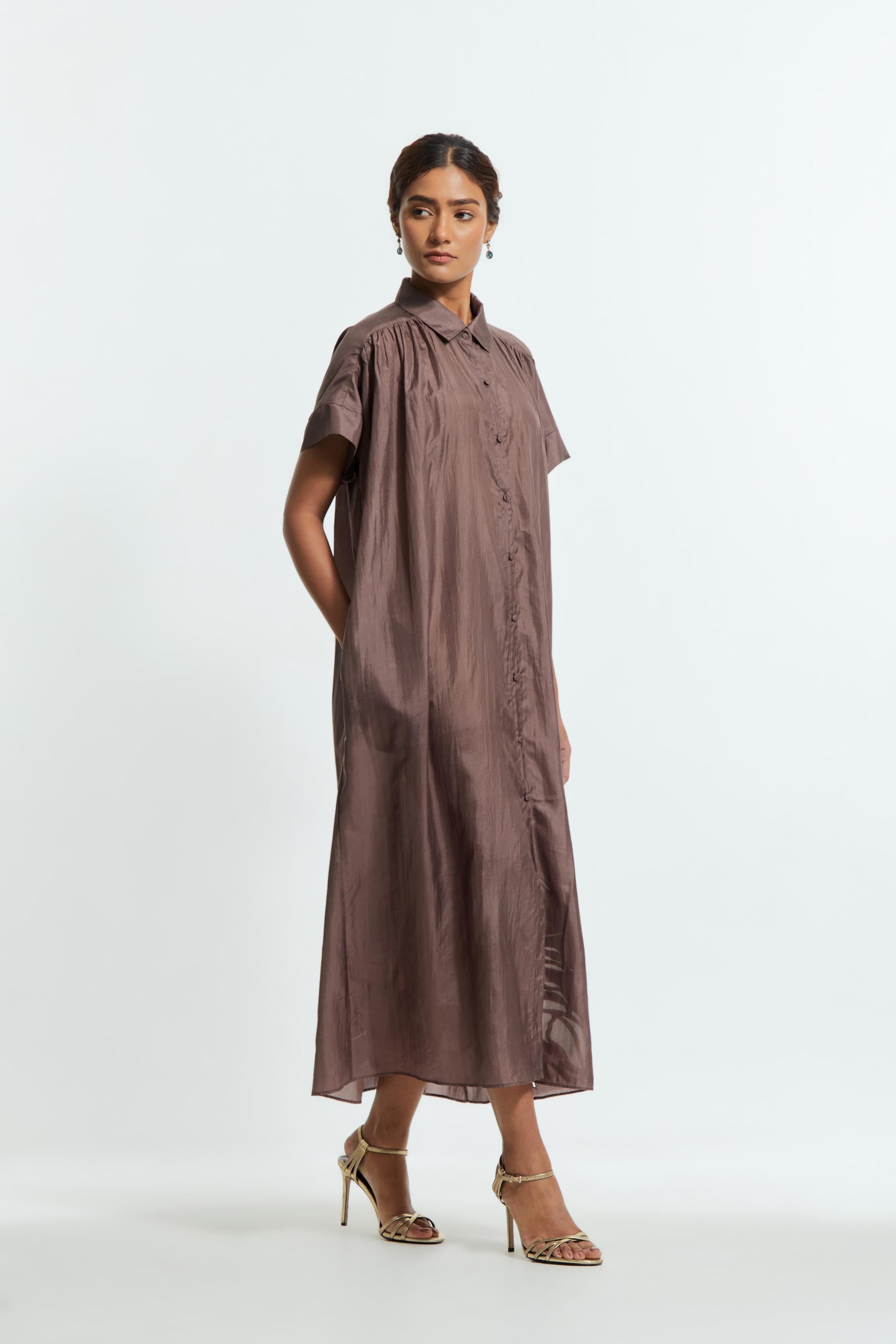 Grey silk long dress adorned with appliqué chrysanthemum floral motifs along one side, delicately highlighted with fine French knots and subtle sequins.