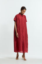 Red silk long dress adorned with appliqué chrysanthemum floral motifs along one side, delicately highlighted with fine French knots and subtle sequins.