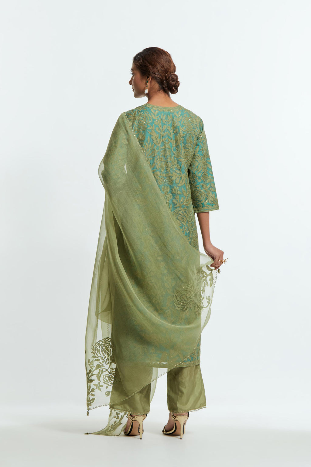 Green silk organza straight kurta set featuring an all-over silk appliqué trellis jaal, delicately highlighted with subtle sequins.