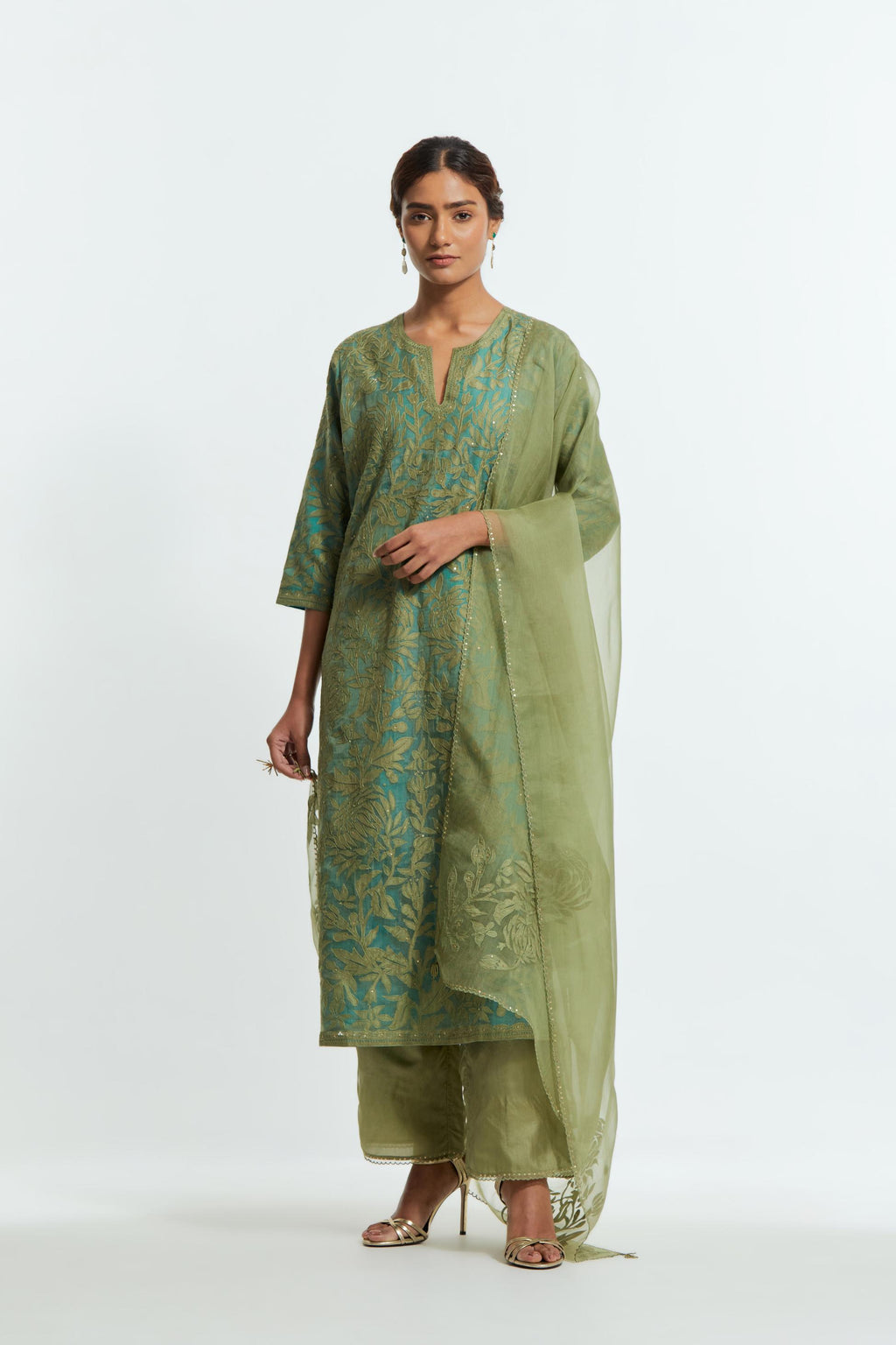 Green silk organza straight kurta set featuring an all-over silk appliqué trellis jaal, delicately highlighted with subtle sequins.