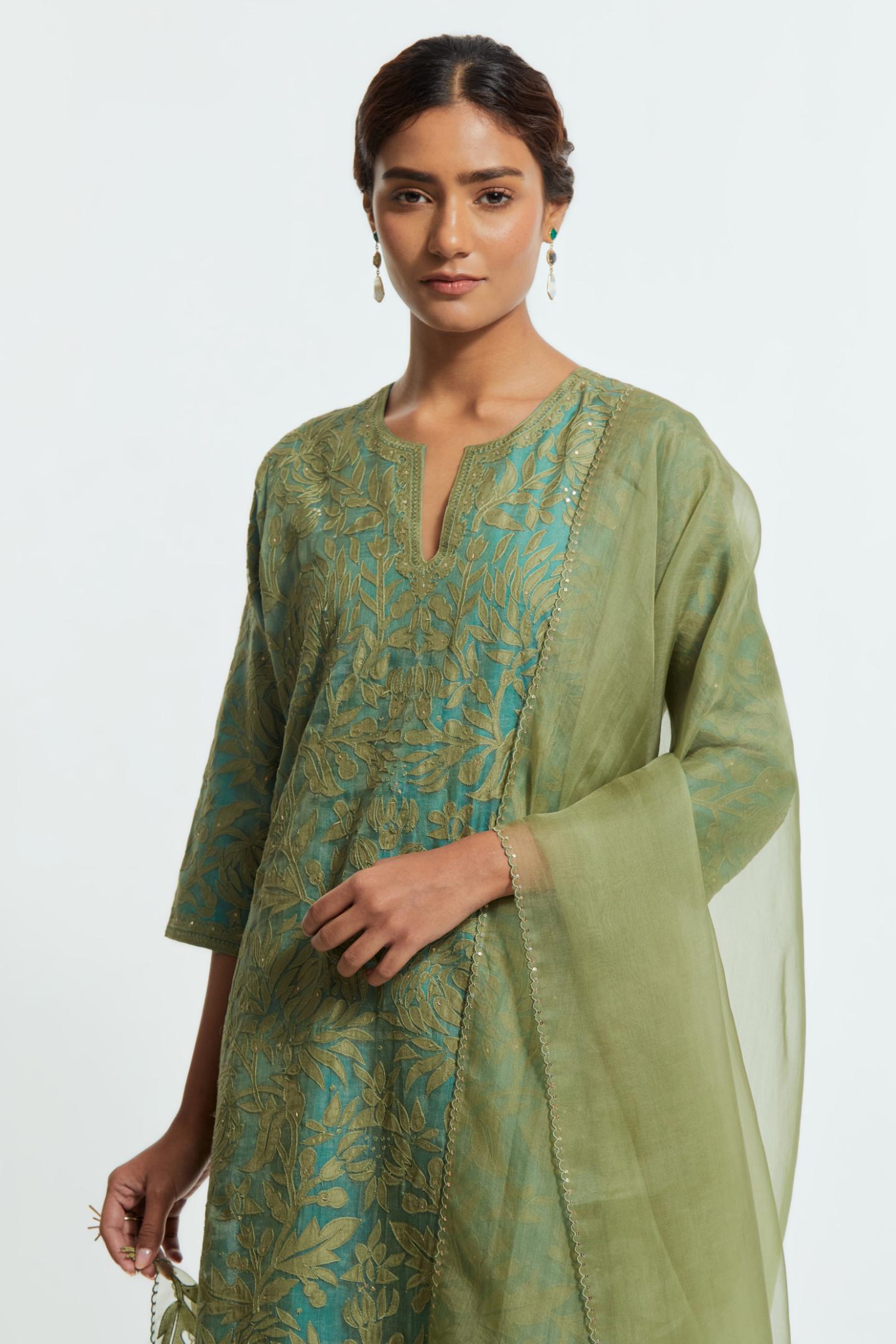 Green silk organza dupatta adorned with appliqué chrysanthemum floral motifs along all four borders, delicately highlighted with subtle sequins.