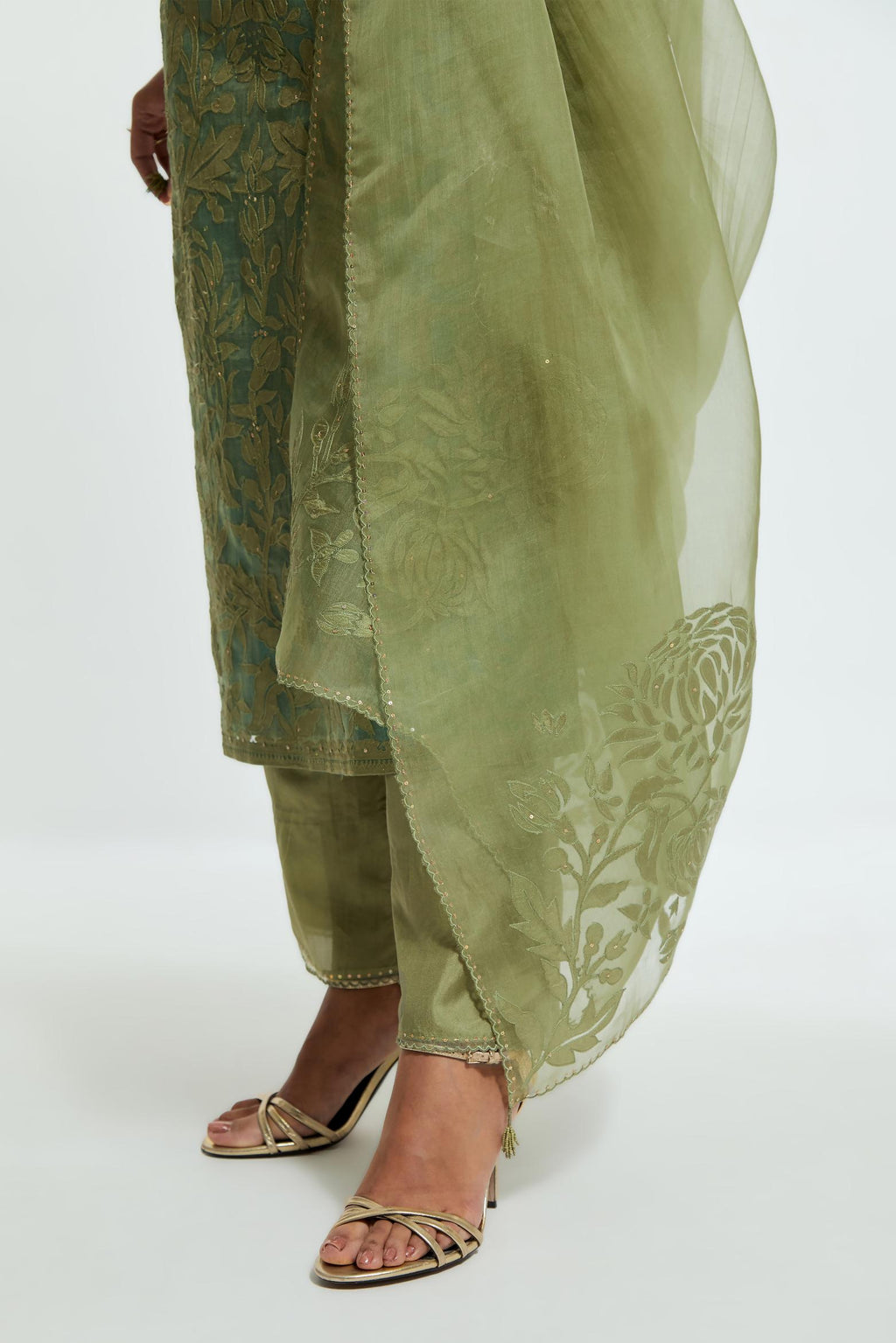 Green silk organza straight kurta set featuring an all-over silk appliqué trellis jaal, delicately highlighted with subtle sequins.