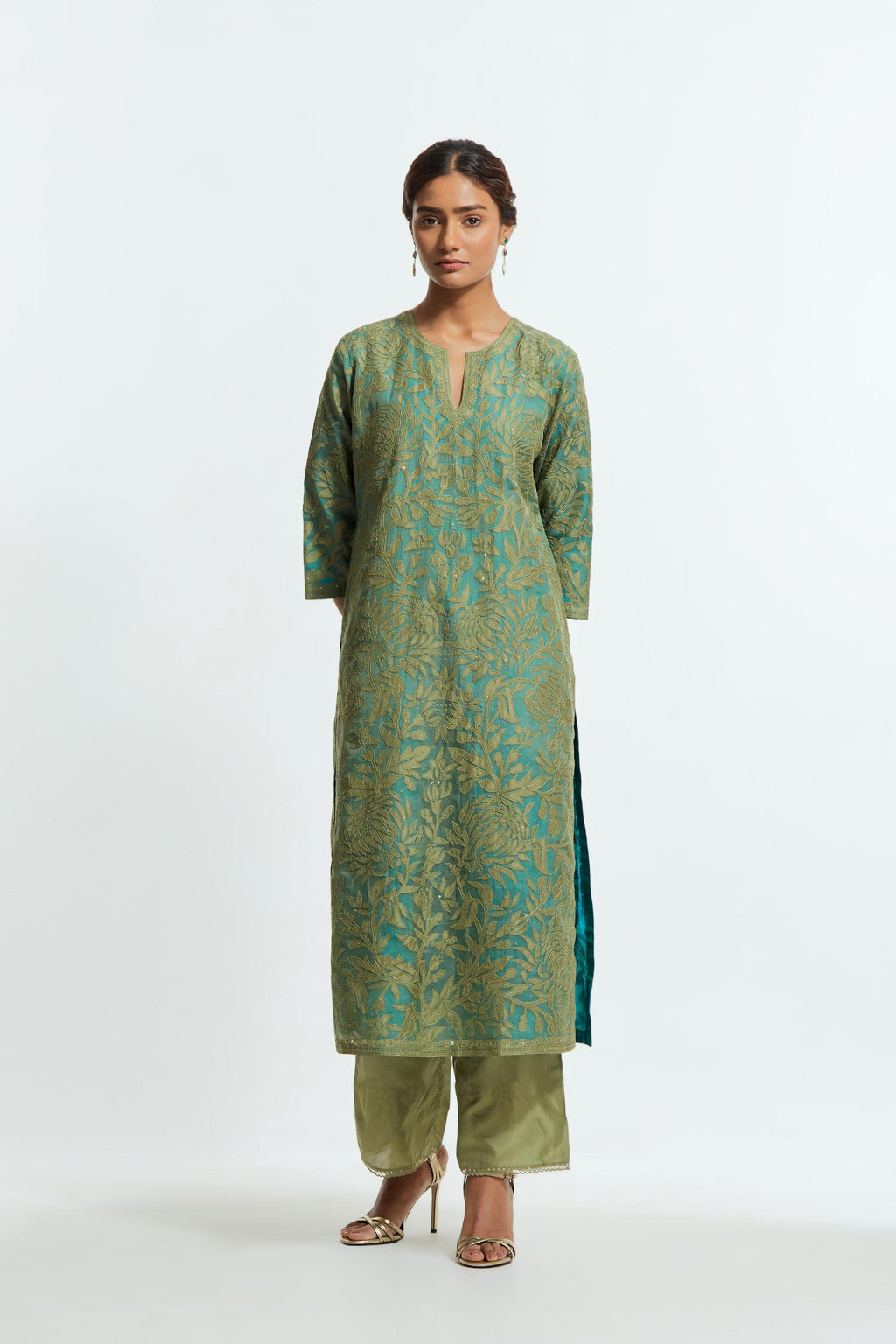 Green silk organza straight kurta set featuring an all-over silk appliqué trellis jaal, delicately highlighted with subtle sequins.