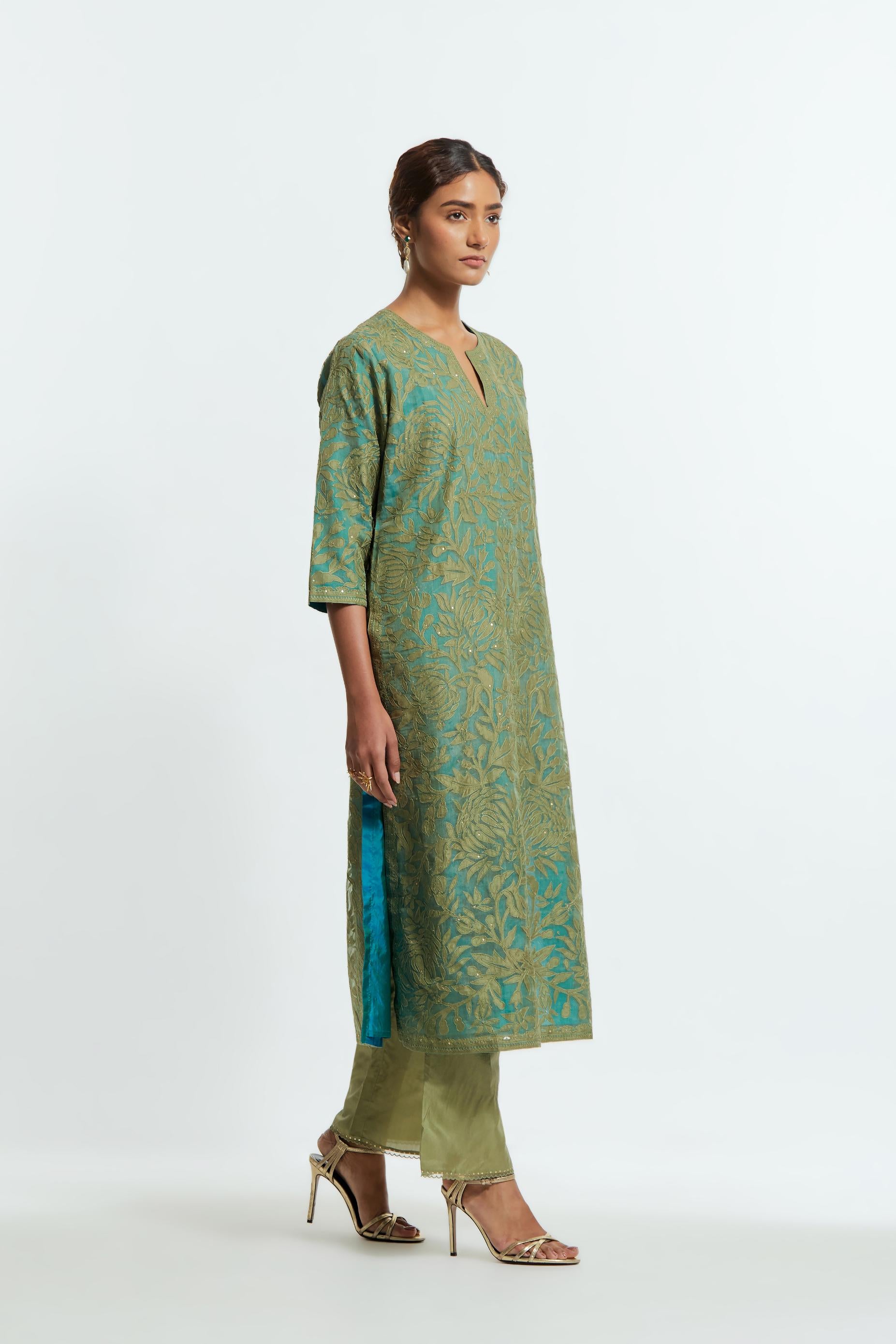 Green silk organza straight kurta set featuring an all-over silk appliqué trellis jaal, delicately highlighted with subtle sequins.