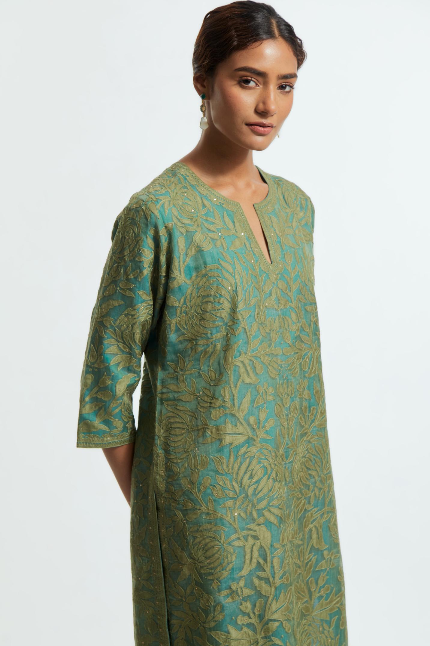 Green silk organza straight kurta set featuring an all-over silk appliqué trellis jaal, delicately highlighted with subtle sequins.