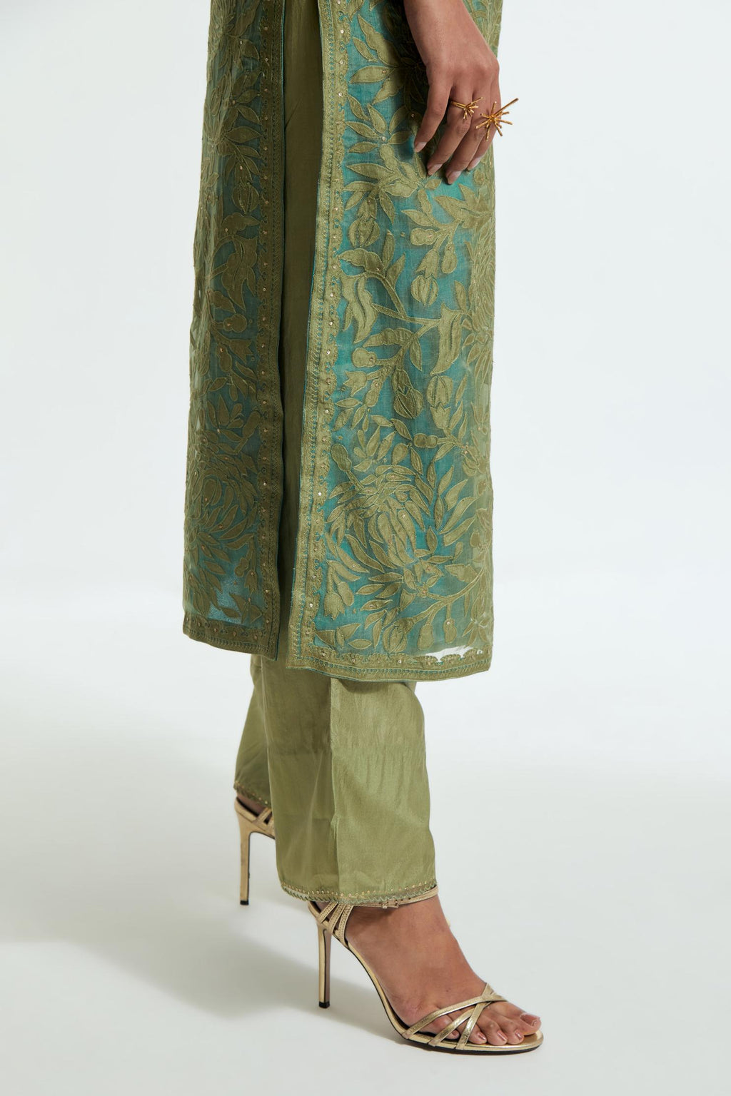 Green silk organza straight kurta set featuring an all-over silk appliqué trellis jaal, delicately highlighted with subtle sequins.