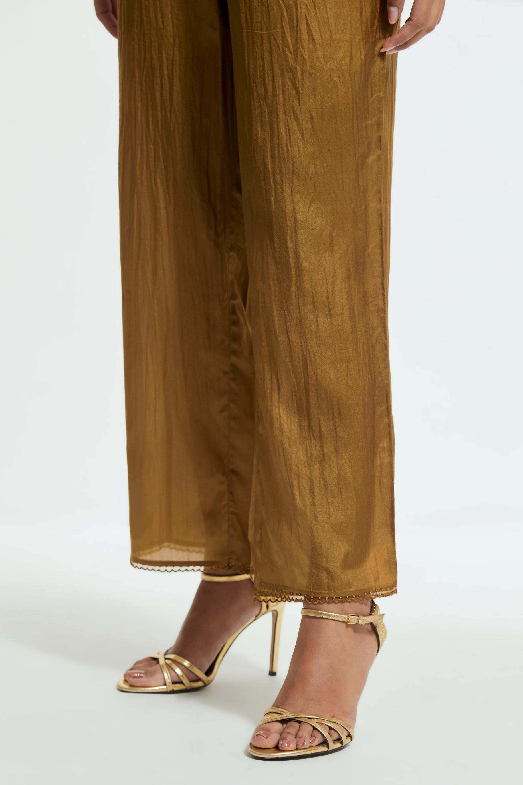 Olive silk straight pants detailed with scalloped organza edging at the hem, delicately highlighted with tonal beadwork.