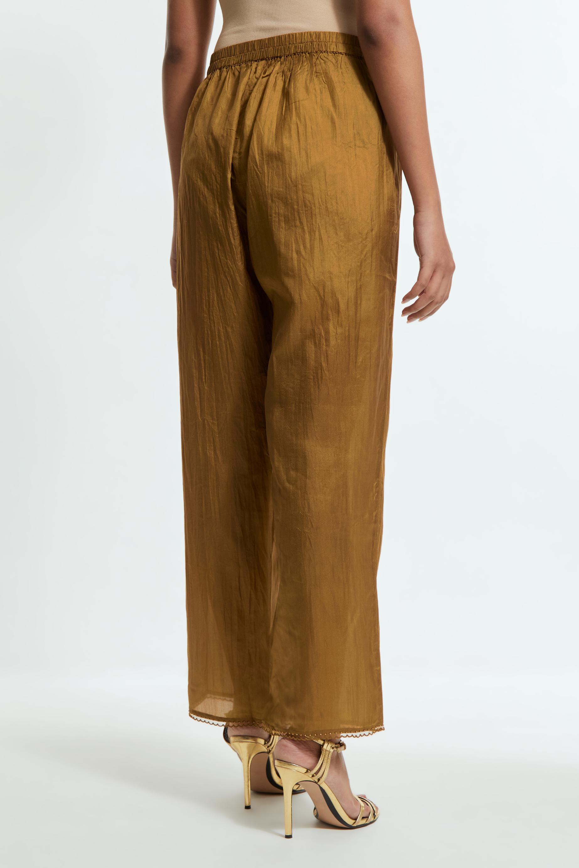 Olive silk straight pants detailed with scalloped organza edging at the hem, delicately highlighted with tonal beadwork.