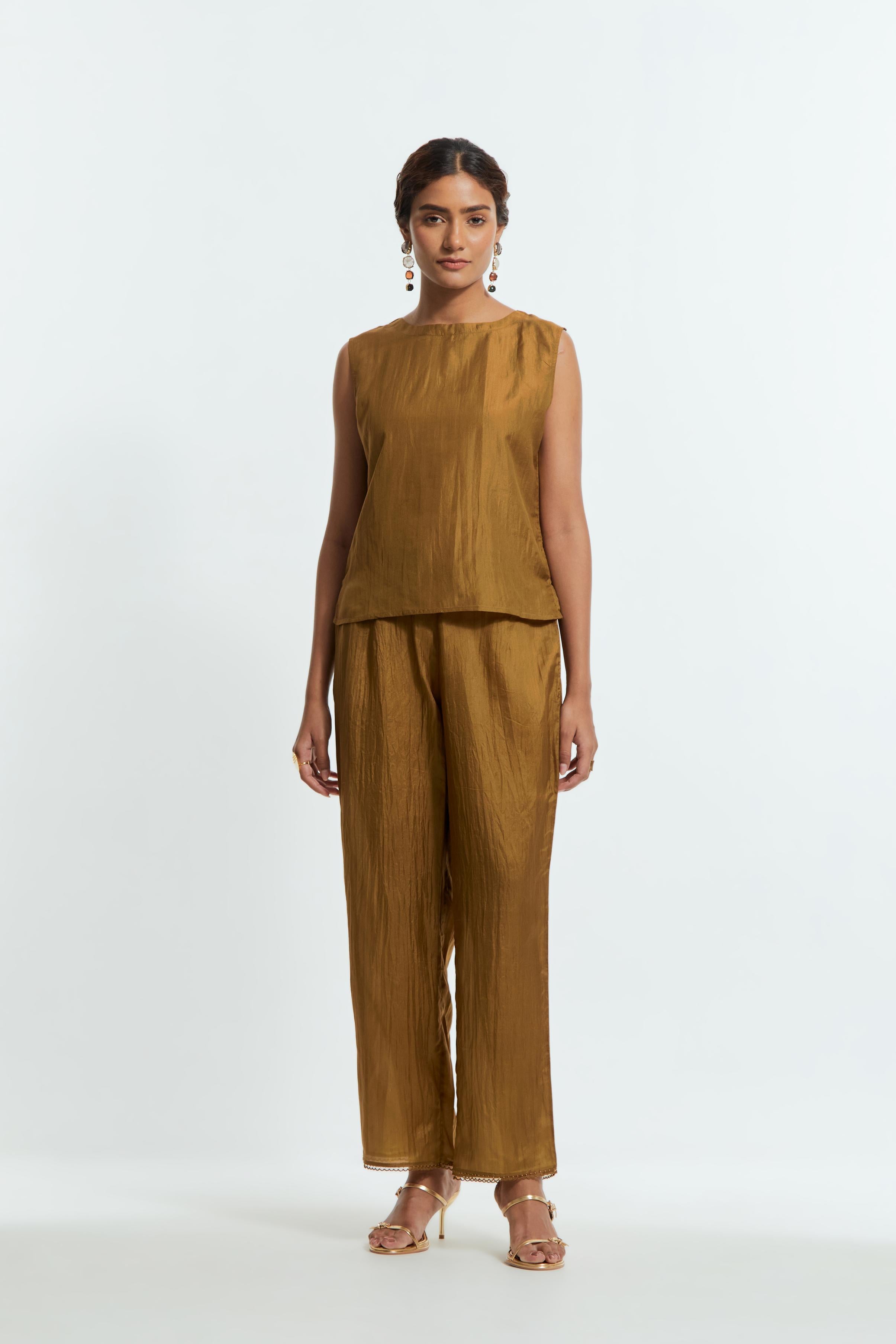 Olive silk organza kaftan with a sheer finish, delicately adorned with appliqué bird motifs along the hem and sides. Paired with Olive silk straight pants detailed with scalloped organza edging at the hem, delicately highlighted with tonal beadwork.