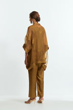 Olive silk organza short kaftan top with a sheer finish, delicately adorned with appliqué bird motifs along the hem and sides. Paired with olive silk straight pants detailed with scalloped organza edging at hem, delicately highlighted with tonal beadwork.