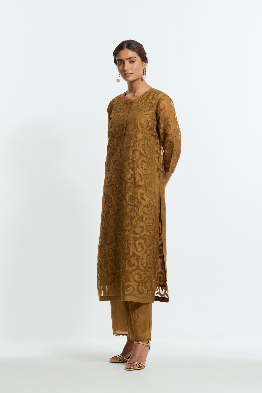 Olive silk organza straight kurta set featuring an all-over silk appliqué trellis jaal, delicately highlighted with aari thread work.