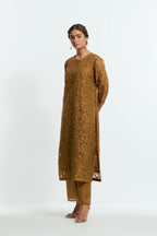 Olive silk organza straight kurta set featuring an all-over silk appliqué trellis jaal, delicately highlighted with aari thread work.