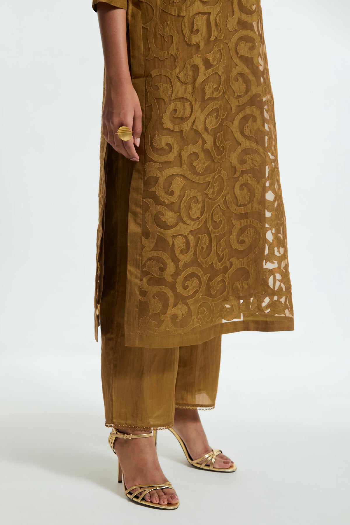 Olive silk organza straight kurta set featuring an all-over silk appliqué trellis jaal, delicately highlighted with aari thread work.