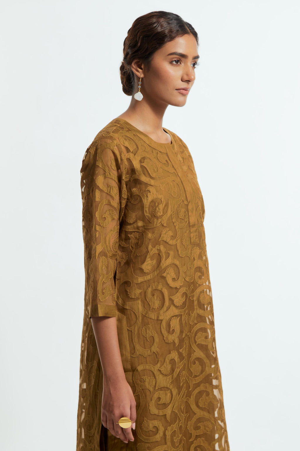 Olive silk organza straight kurta set featuring an all-over silk appliqué trellis jaal, delicately highlighted with aari thread work.