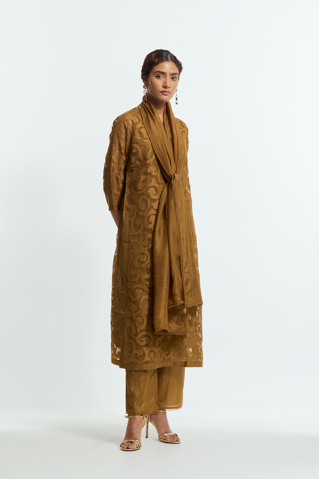 Olive silk organza straight kurta set featuring an all-over silk appliqué trellis jaal, delicately highlighted with aari thread work.