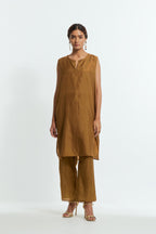 Olive silk organza easy-fit short kurta set adorned with an all-over silk appliqué trellis jaal, delicately highlighted with aari thread embroidery.