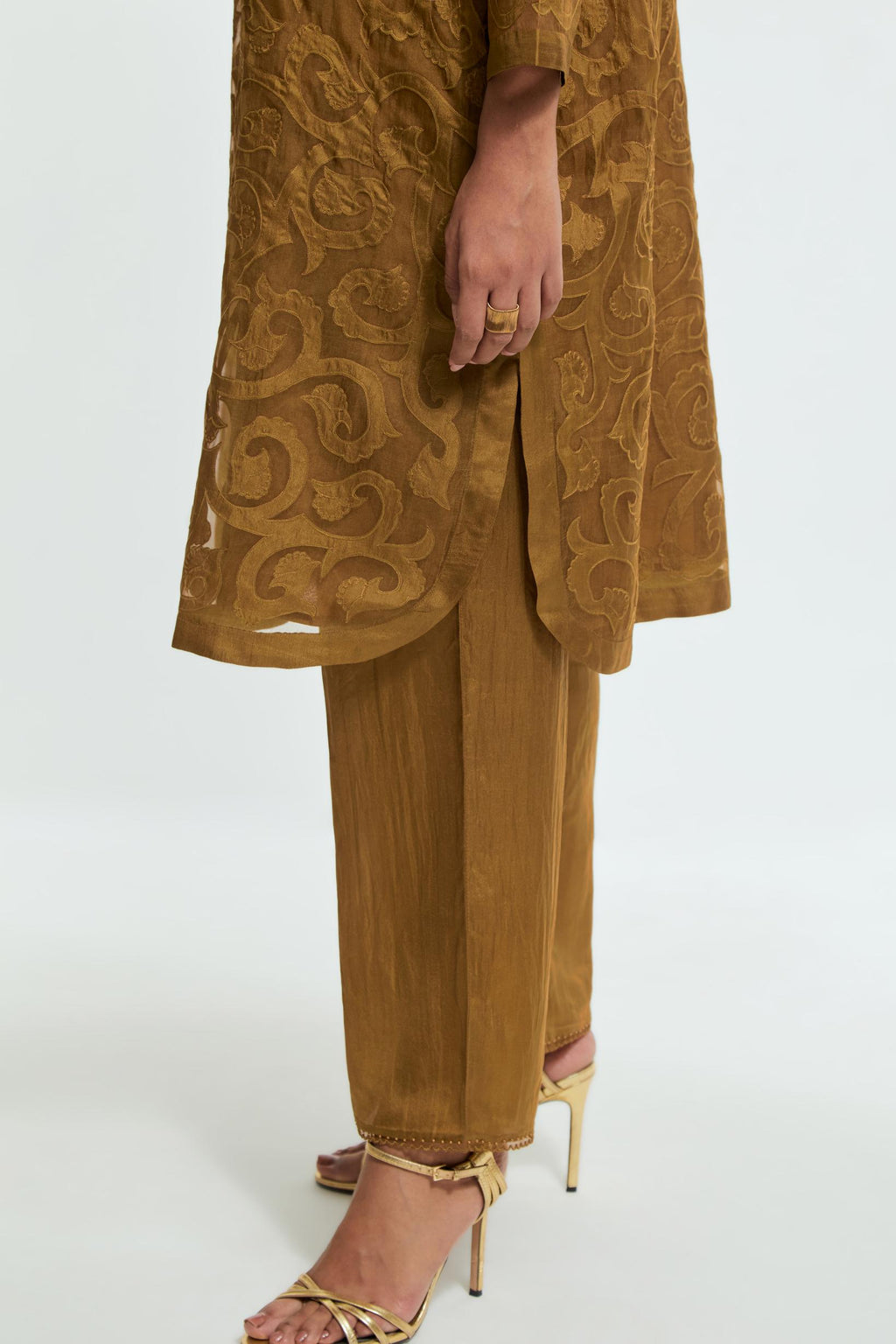 Olive silk organza easy-fit short kurta set adorned with an all-over silk appliqué trellis jaal, delicately highlighted with aari thread embroidery.