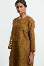 Olive silk organza easy-fit short kurta set adorned with an all-over silk appliqué trellis jaal, delicately highlighted with aari thread embroidery.