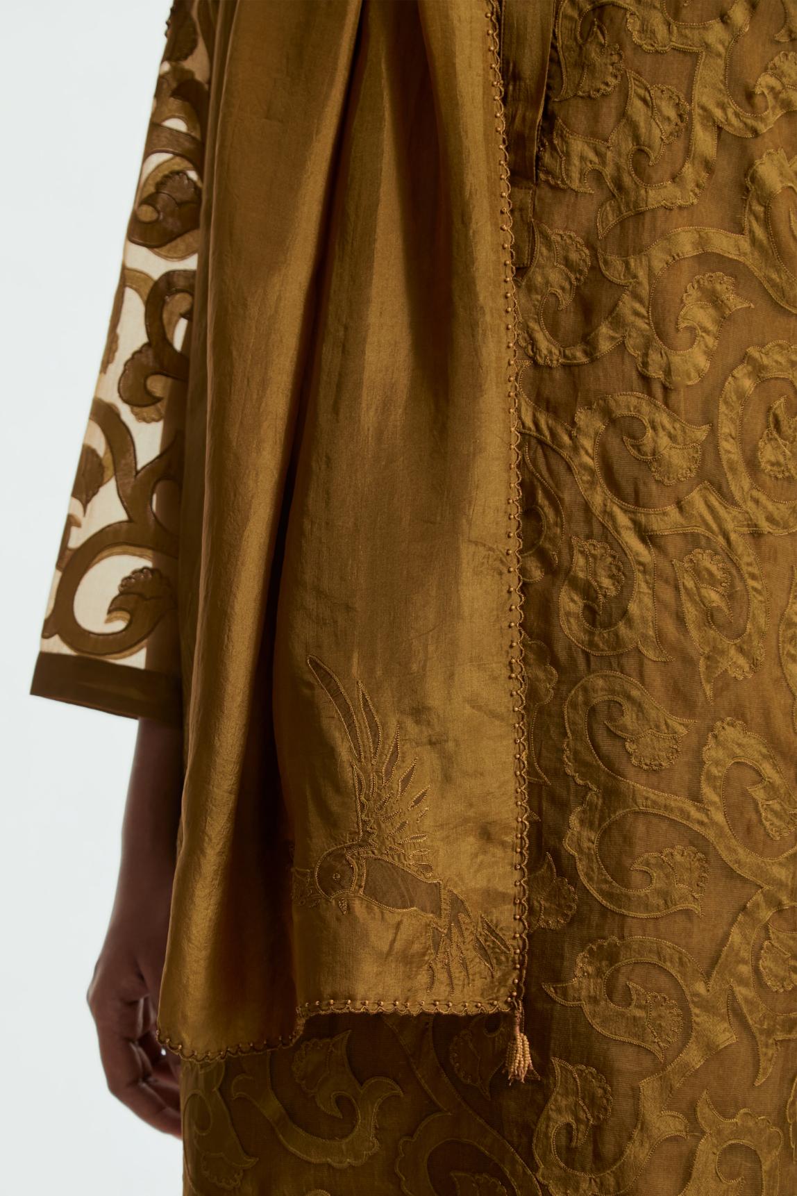 Olive light silk stole featuring bird motif appliqué embroidery at all four corners.