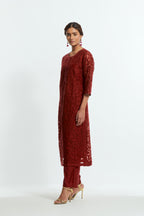 Red silk organza straight kurta set featuring an all-over silk appliqué trellis jaal, delicately highlighted with aari threadwork.