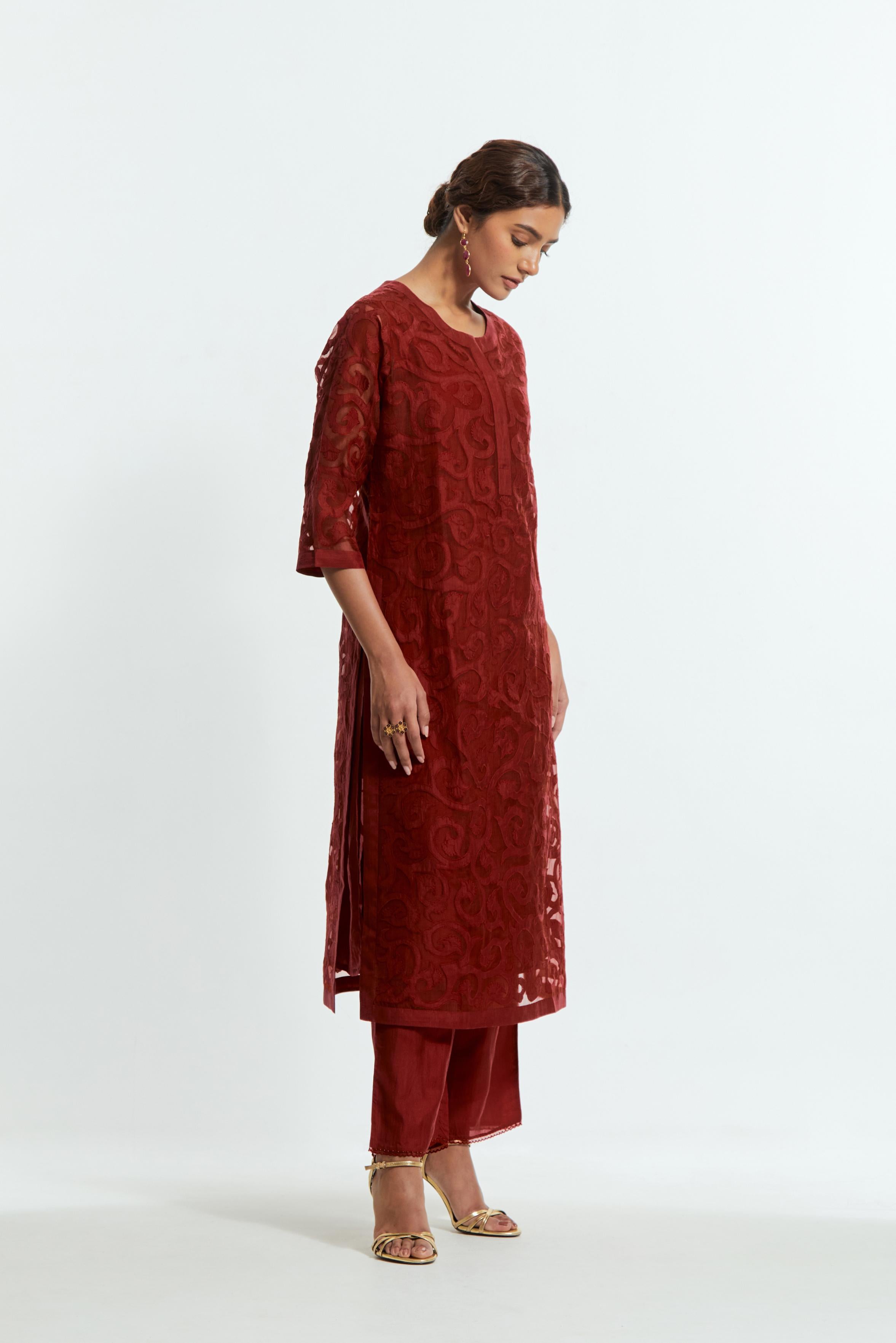 Red silk organza straight kurta set featuring an all-over silk appliqué trellis jaal, delicately highlighted with aari threadwork.