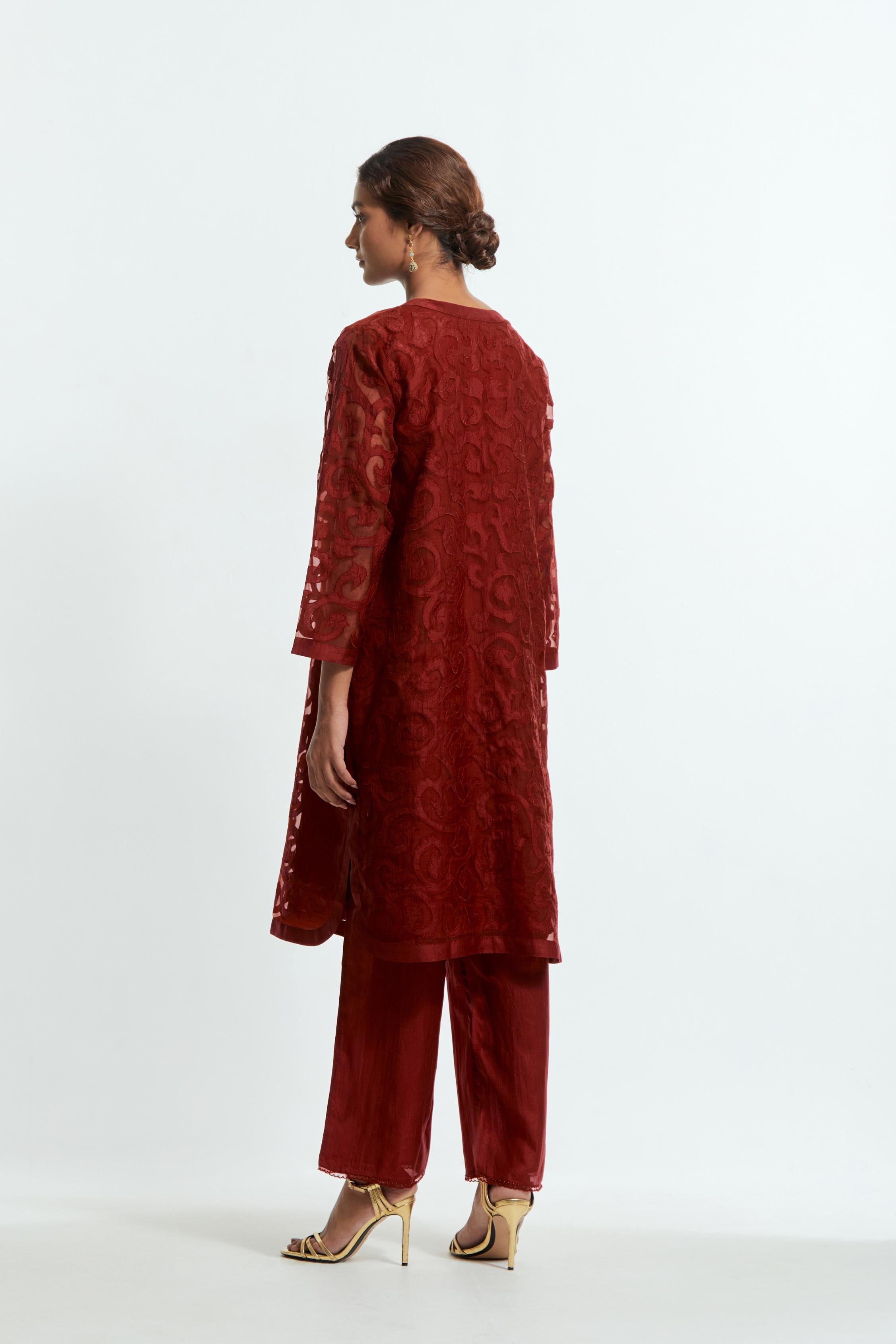 Red silk organza easy-fit short kurta set adorned with an all-over silk appliqué trellis jaal, delicately highlighted with aari thread embroidery.