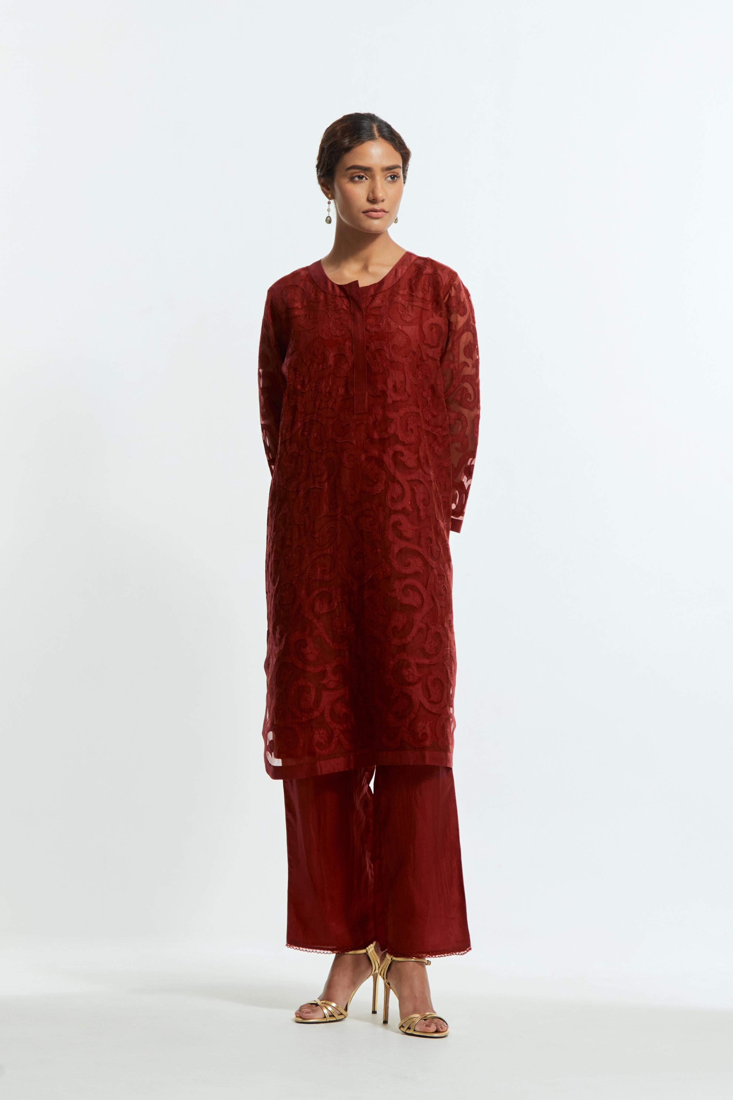 Red silk organza easy-fit short kurta set adorned with an all-over silk appliqué trellis jaal, delicately highlighted with aari thread embroidery.