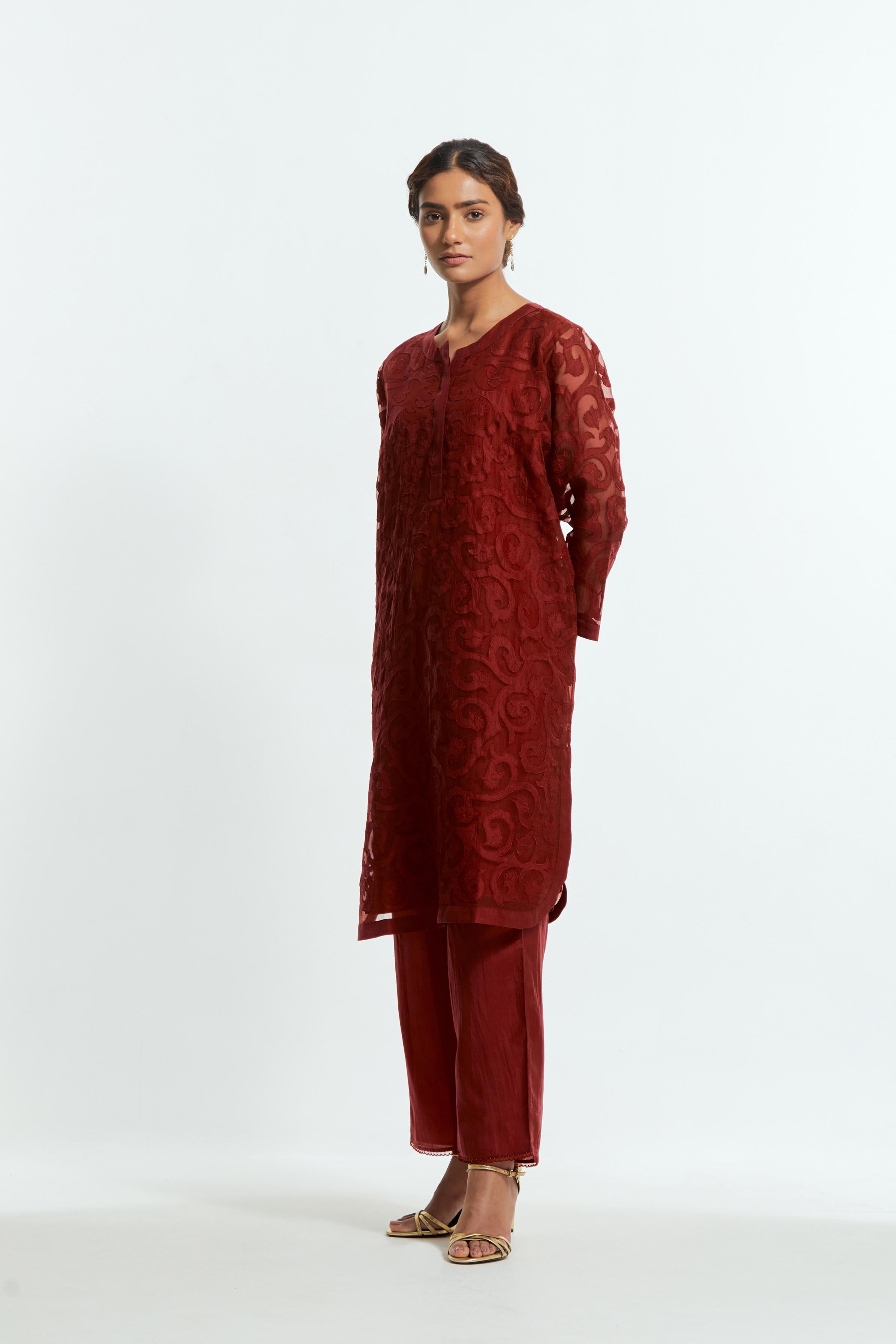 Red silk organza easy-fit short kurta set adorned with an all-over silk appliqué trellis jaal, delicately highlighted with aari thread embroidery.