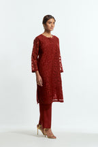 Red silk organza easy-fit short kurta set adorned with an all-over silk appliqué trellis jaal, delicately highlighted with aari thread embroidery.