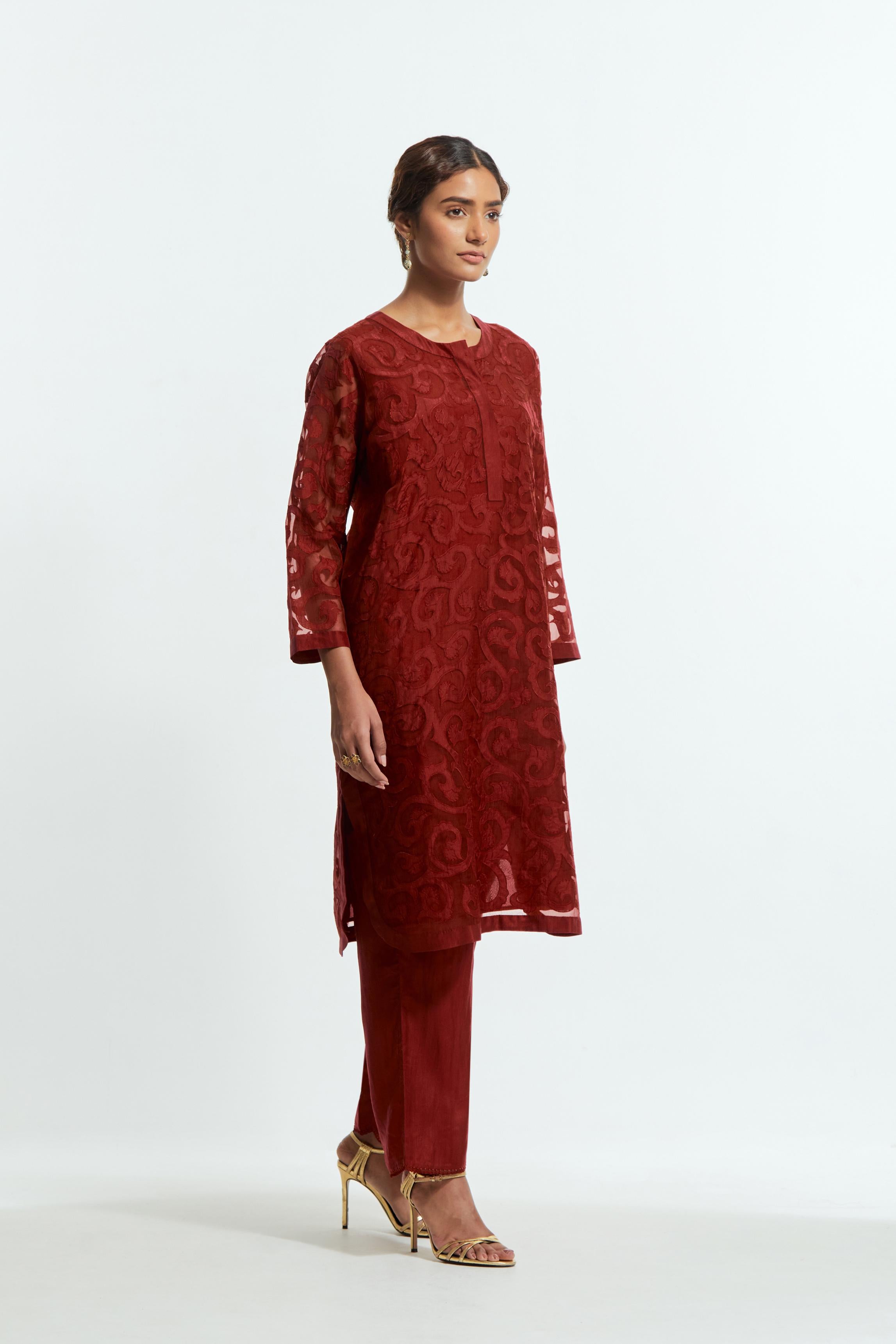 Red silk organza easy-fit short kurta set adorned with an all-over silk appliqué trellis jaal, delicately highlighted with aari thread embroidery.
