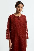 Red silk organza easy-fit short kurta set adorned with an all-over silk appliqué trellis jaal, delicately highlighted with aari thread embroidery.