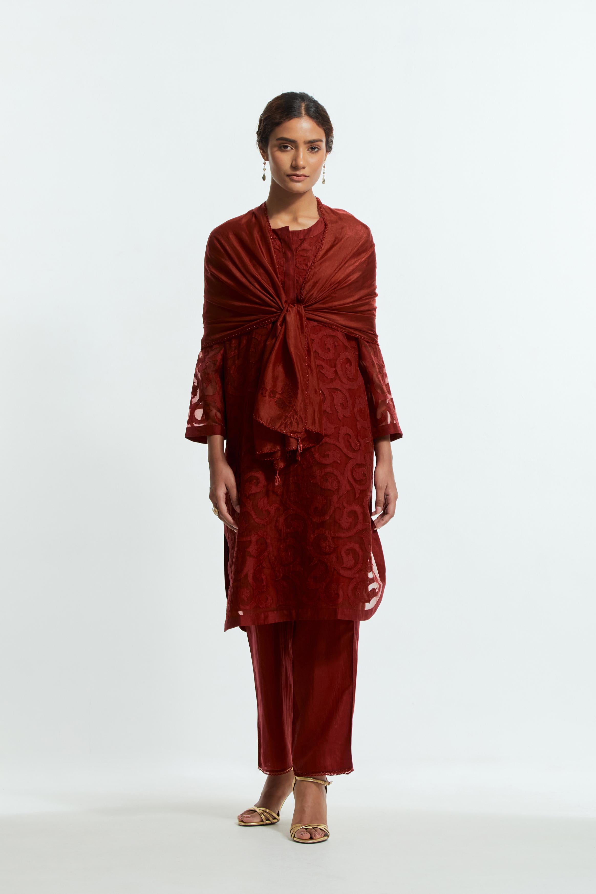 Red silk organza easy-fit short kurta set adorned with an all-over silk appliqué trellis jaal, delicately highlighted with aari thread embroidery.
