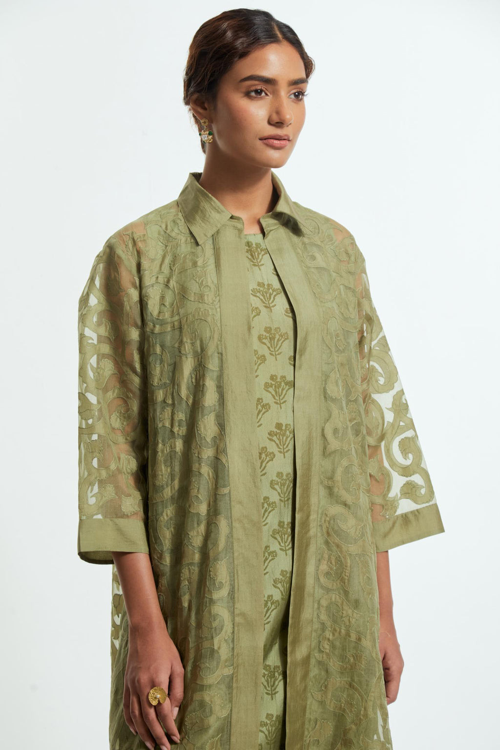 Green Sheer overlay set in silk organza with a shirt collar, highlighted with all-over silk appliqué trellis jaal.