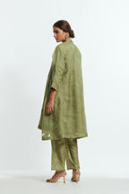Green silk organza A-line short kurta featuring appliqué bird motifs gracefully placed across the front, back and sleeves. Paired with Green silk straight pants detailed with scalloped organza edging at the hem, delicately highlighted with tonal beadwork.
