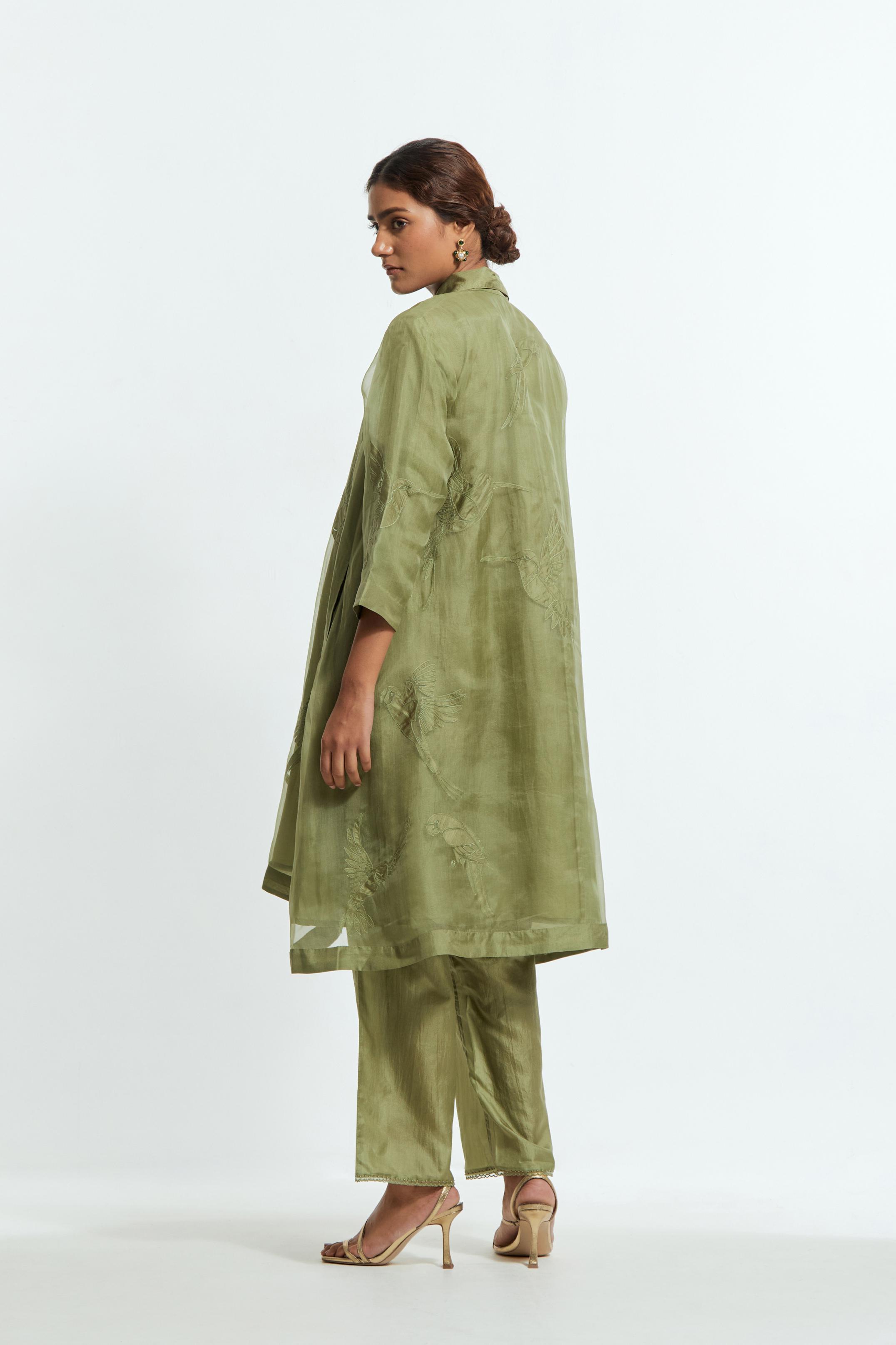Green silk organza A-line short kurta featuring appliqué bird motifs gracefully placed across the front, back and sleeves. Paired with Green silk straight pants detailed with scalloped organza edging at the hem, delicately highlighted with tonal beadwork.